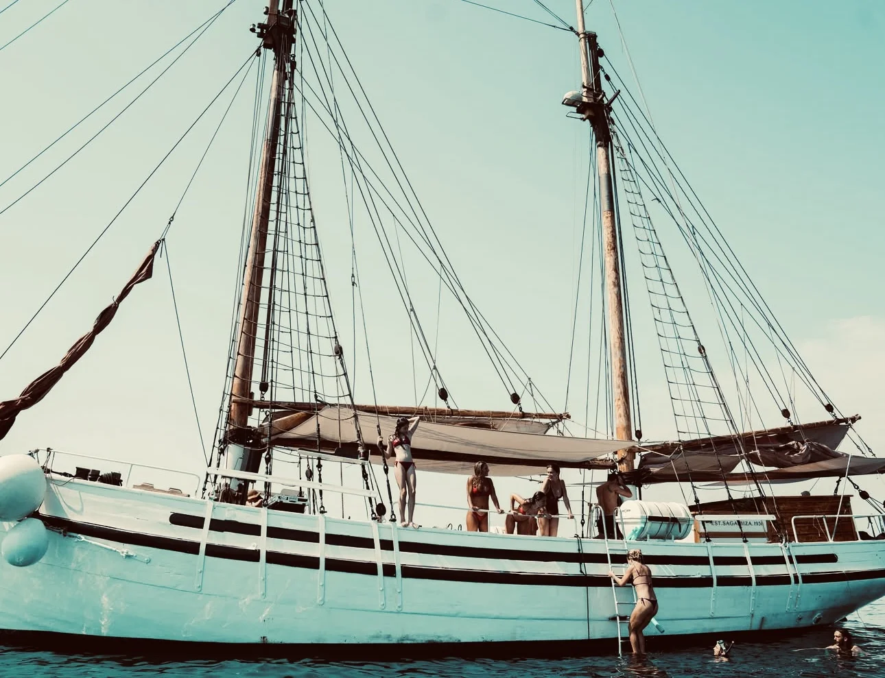 Authentic wooden sailboat sailing off Ibiza